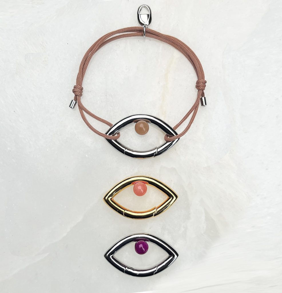 Iconic and empowering, the Eye Opener Collection is inspired by ancient symbology and given a contemporary twist. The eye is a powerful universal symbol of protection, wisdom, knowledge and mystery. In additional, the third eye is known as the sixth chakra, where you inhabit your authentic voice and intuition. It helps you make clear decisions to reach your true purpose in life. The eye as a functioning clip is a metaphor for the third eye opening.